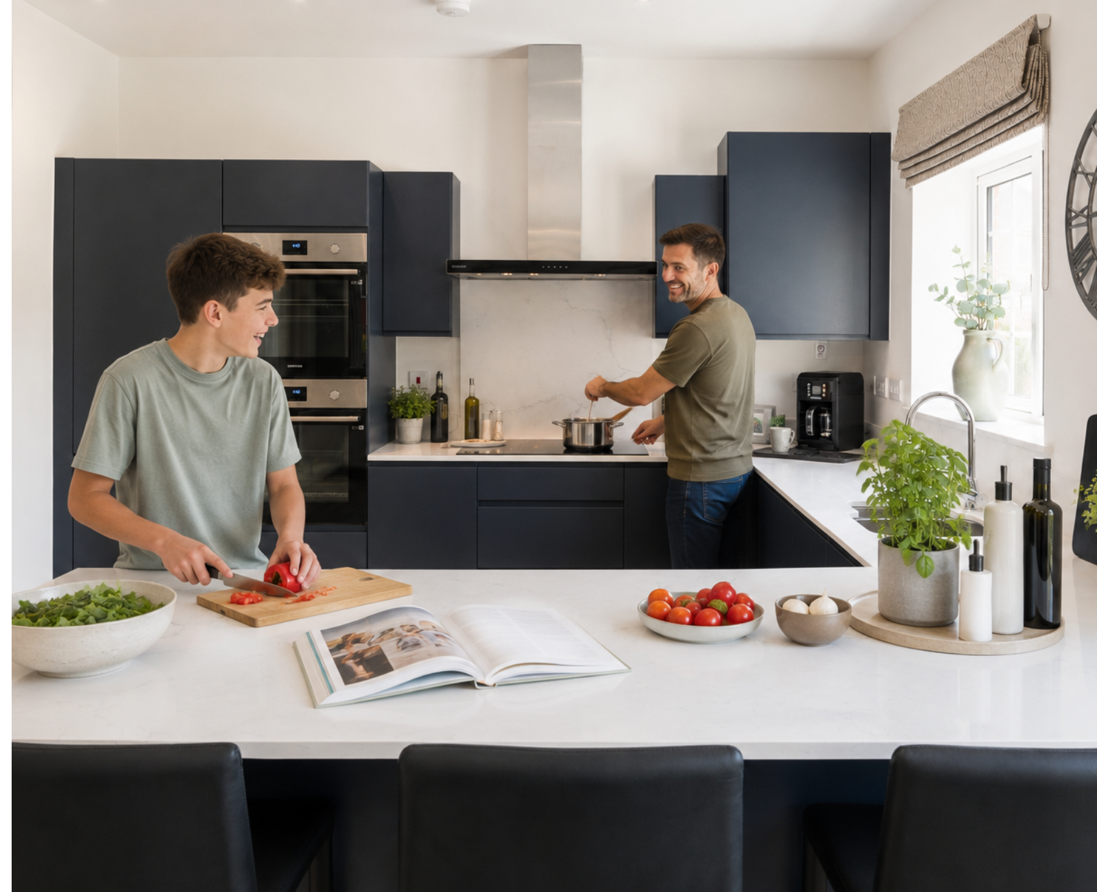 Father and teenage son cooking dinner together in a bright, modern Owl Homes kitchen.